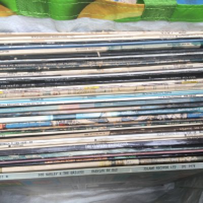 A collection of LPs by various artists including a re/plum Atlantic label Led Zeppelin II, Bob Marley, The Beatles, Jimi Hendrix and others.