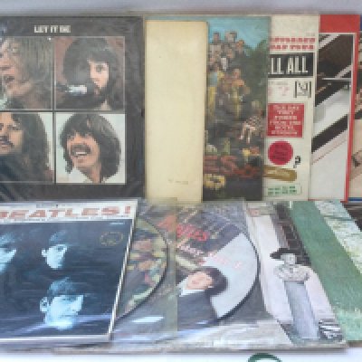 Twelve Beatles and related LPs including a numbered 'White Album' 0054928 (no inserts), Let It Be, Plastic Ono Band and others, includes US pressings.