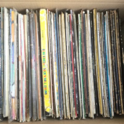 A box of LPs and 12" singles by various artists including The Beatles, Grand Funk Railroad, Gene Vincent and many more.