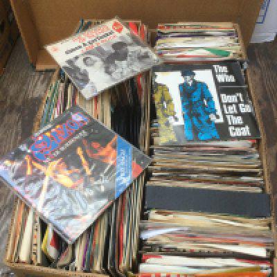 Two boxes if 7" singles and EPs by various artists including The Beatles, The Who, Iron Maiden and many more. Includes some promo discs.