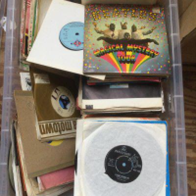 Two boxes of 7" singles and EPs by various artists including Queen, The Beatles, The Move and many more.