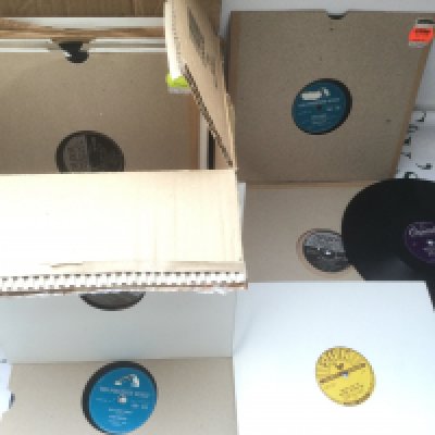 A collection of rock n roll 78s by various artists including Elvis Presley, Jerry Lee Lewis, Gene Vincent and others.