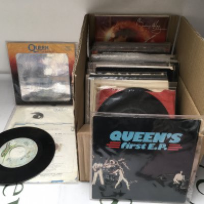 A box of Queen 7" singles and EPs including a Japanese Another One Bites The Dust, limited edition pressings etc.