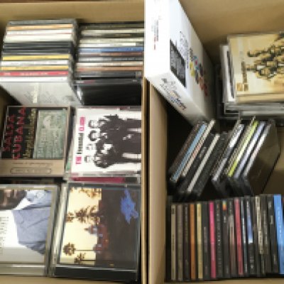 Four boxes of CDs and DVDs.