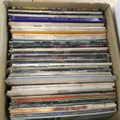 A box of LPs by various artists including Pink Floyd, Jethro Tull, Bob Dylan and others.