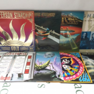 Seventeen rock LPs by various artists including Kiss, Van Halen, Foreigner and others. Includes two promo discs.