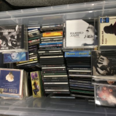 A large box of CDs by various artists including Paul Weller, Supergrass, Led Zeppelin and many more.