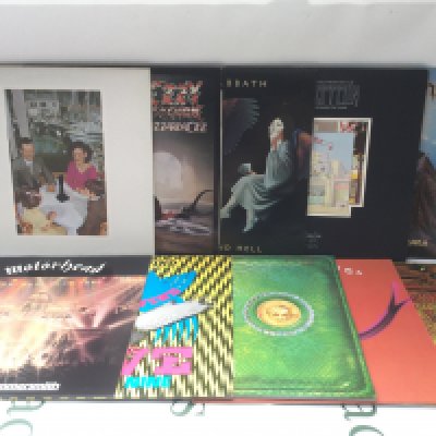 Two bags containing twenty heavy rock LPs by various artists including Iron Maiden, Led Zeppelin, Black Sabbath and others. Includes two Judas Priest promo discs.