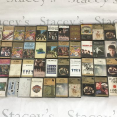 A collection of Beatles and related audio cassettes.