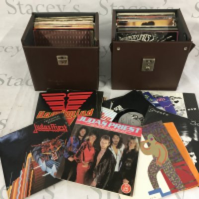 Four record cases of 7" singles and EPs comprising mainly 1980s rock and pop artists.