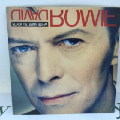 A first UK pressing of the David Bowie LP 'Black Tie White Noise', 74321 13697 1. Sleeve Ex, Vinyl Ex.
