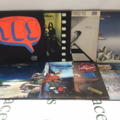 Two bags containing sixteen Yes and related LPs. Includes two promo discs.
