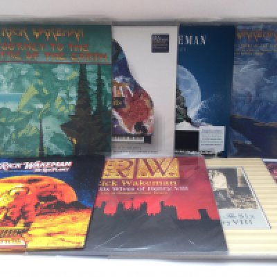 Two bags containing 16 Rick Wakeman LPs comprising 180g vinyl and original pressings.