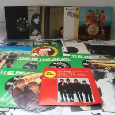 A collection of Beatles and solo 7" singles and EPs.