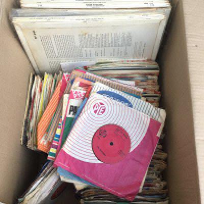 A box of 7" singles, EPs and LPs by various artists including Elvis Presley, The Yardbirds, The Kinks and many more.