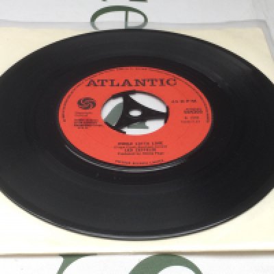 A very rare 7" pressing of the Led Zeppelin single 'Whole Lotta Love'. It was withdrawn before it was put into sale because the band and the label couldn't find an agreement over the release. Only a few hundred copies were somehow "leaked" to public, rumours say, from a warehouse in Manchester. Matrix 584309. Condition Ex.
