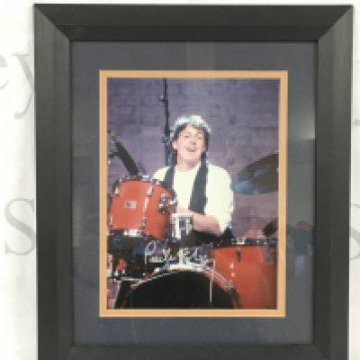 A signed photo of Paul McCartney with COA.