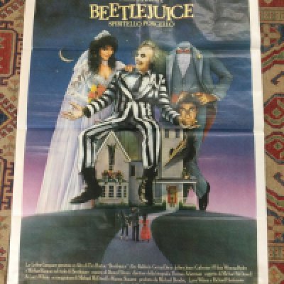 An Italian film poster for Beetlejuice, rolled with a tear at the top. Approx 140cm x 100cm.