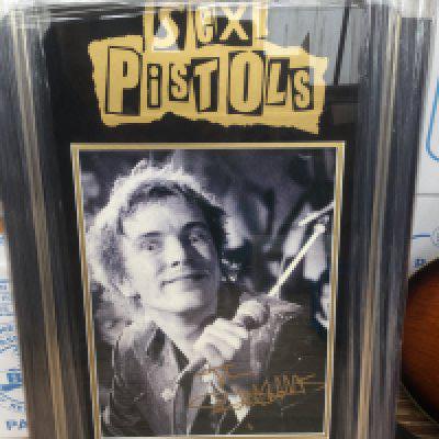 A framed and glazed Sex Pistols display signed by John Lydon with COA, approx 78cm x 48cm.