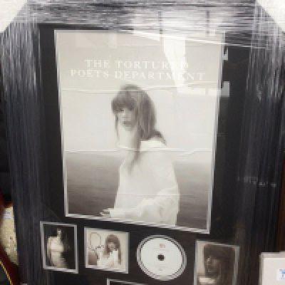 A framed and glazed signed Taylor Swift display of The Tortured Posts Department, approx 92.5cm x 70cm.