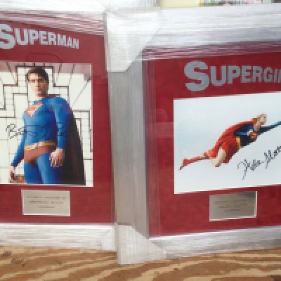 Two framed and glazed Superman and Supergirl displays signed by Brandon Routh and Helen Slater with COA for Superman, approx 55cm x 43cm and 51cm x 47cm.