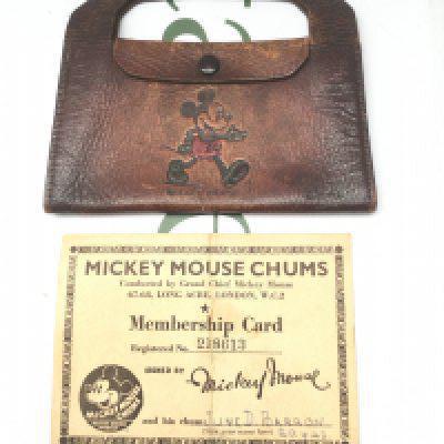 An original Mickey Mouse Chums membership card dated 20/04/1943 and a brown leather Mickey Mouse purse.