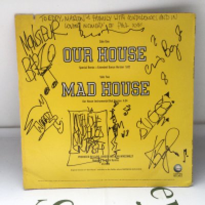 A signed Madness 12" single of Our House.