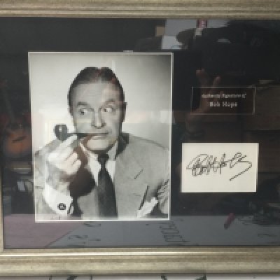 A framed and glazed signed Bob Hope display with COA, approx 51cm x 43cm.