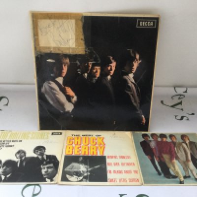 Three Rolling Stones autographs comprising Brian Jones, Mick Jagger and Bill Wyman signed in blue biro on paper sellotaped to an early UK pressing of the self titled debut LP together with two EPs and a Chuck Berry EP.