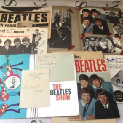 A collection of Beatles ephemera including Paul and Ringo's signatures, scrapbook, programs etc,