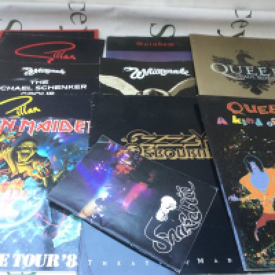 A collection of rock music programs, some with tickets. Artists include Iron Maiden, Queen, Gillan and others.