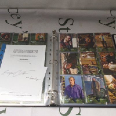 A binder of mainly Breaking Bad trading cards plus a Bryan Cranston autograph with COA.