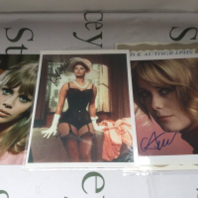 Three signed photos of actresses comprising Sophia Loren, Britt Ekland and Catherine Deneuve plus a Sophia Loren autograph on a booklet page.