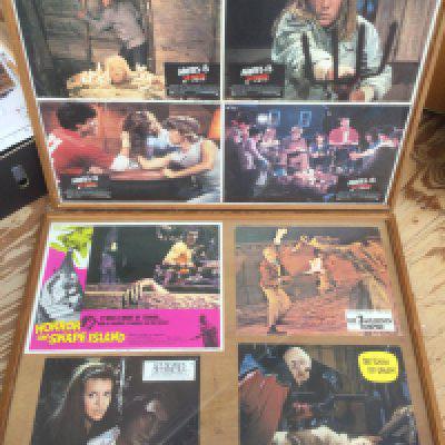 A collection of framed vintage French lobby cards and mini movie posters for various horror films including Jaws 2, Frankenstein 1970, The Haunted Strangler and others.