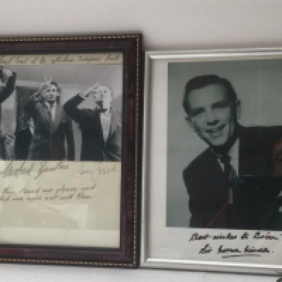 Two framed signed photos of The Goons (no Peter Sellers) and Norman Wisdom.