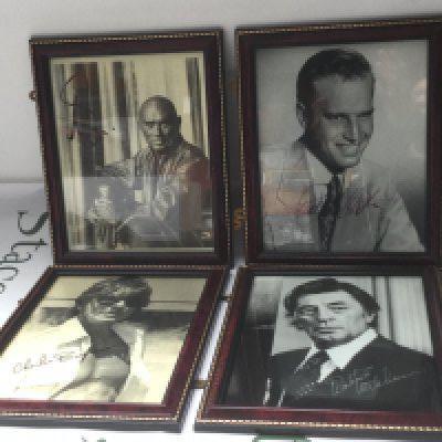Four framed and signed photos including Charlton Heston, Charles Bronson, Yul Brinner and Robert Mitchum.
