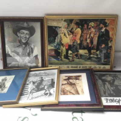 A collection of Western related signed photos and a framed lobby card including Roy Rogers, Clint Eastwood, Jane Russell and others.