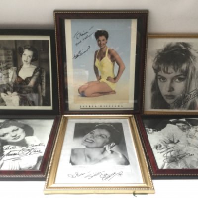 A collection of framed and signed photos of Maureen O'Hara, Cyd Charisse, Esther Williams and others.
