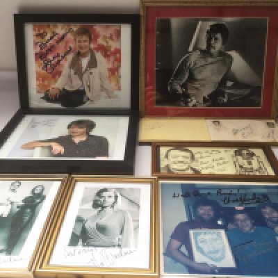 A collection of autographs by various actors and musicians including Charles Bronson, Honor Blackman, Chas n Dave and others.