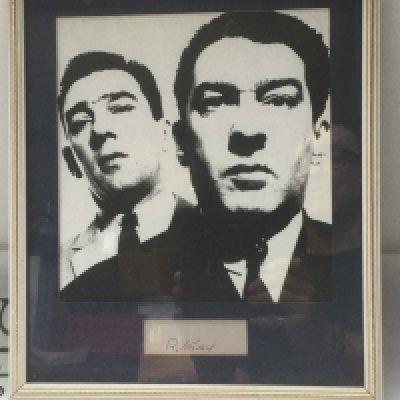 A framed and glazed display of the Kray twins with Reggie Kray's autograph, approx 28cm x 33cm.