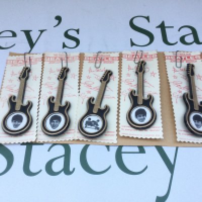 A full set of reproduction Beatles guitar shaped brooches by Invicta Plastics Ltd.