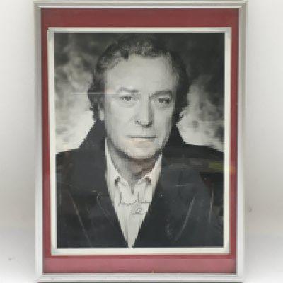 Three framed and signed photos of actors comprising Michael Caine, Kathleen Turner and Tony Bennett. No COAs. Please note that buyers must satisfy themselves as to the authenticity of any signed items before bidding as we are not experts in this field and will not be held responsible should they prove to be anything other than genuine.