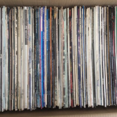 Two boxes of LPs and 12" singles by various artists including Rory Gallagher, Steely Dan, James Brown and many more.