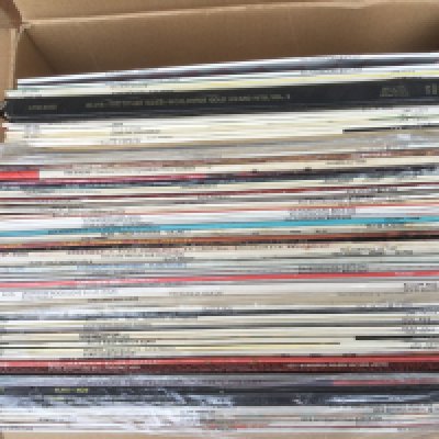 A box of Elvis Presley LPs.