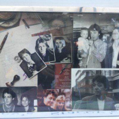 A framed and signed Paul and Linda McCartney montage plus three Beatles posters (4).