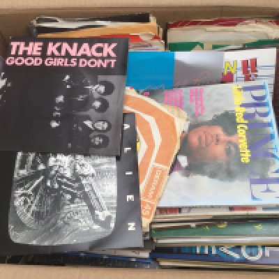 Two boxes of 7" singles by various artists including Prince, Vanilla Fudge, The Ramones and many more.