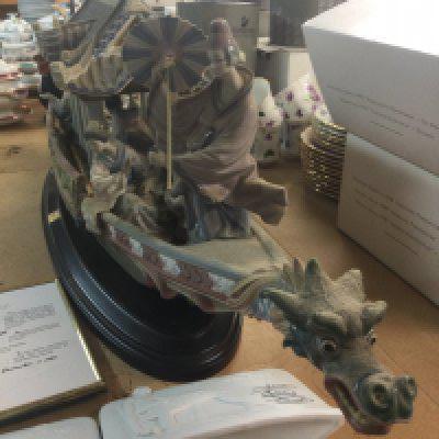 A limited edition Lladro centre piece Kitakami cruise in the form of geisha on a boat surrounded on Stand .99 cm .