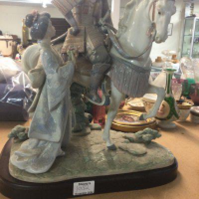 A Lladro figure group Japanese warrior on horse back and Geisha