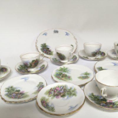 An English bone china tea set decorated with country cottages Royal Vale six place setting with serving plate no obvious damage.