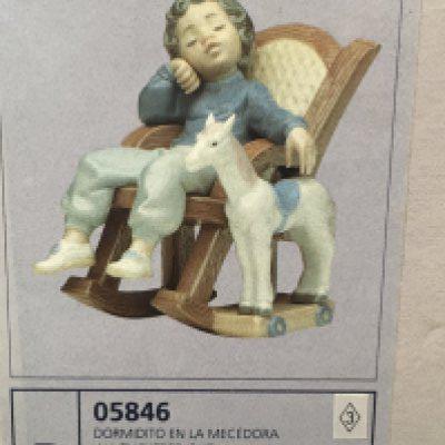 Two boxed Lladro figures All tucked out and playful kittens.